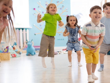 A group of preschool aged children dancing