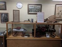 Photo of display case containing Kinsman historical artifacts