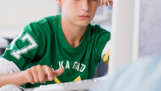 Boy looking at a computer screen
